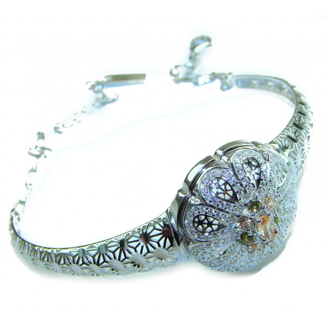 Casablanca Italy made 1.8 carat yellow Sapphire .925 Sterling Silver brilliantly handcrafted Bracelet - Silver bracelet with floral design and yellow sapphire, side view.