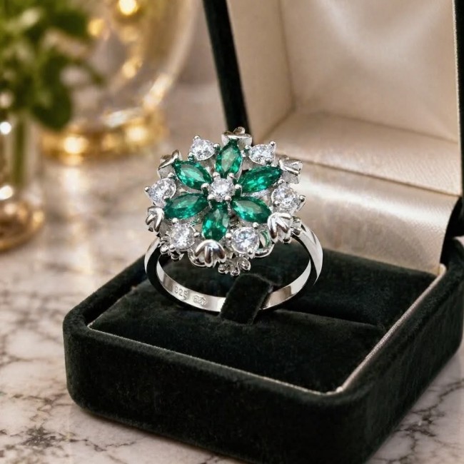 Real 3.2 carat Emerald Italy Made Silver Sterling Silver spinning ring s. 7 1/2 - Emerald and diamond floral ring in open box, front view.