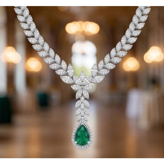 Gabriella 22.7 carat authentic Emerald rhodium over .925 Sterling Silver handcrafted Statement necklace - Emerald necklace front view with diamond leaf design background blur