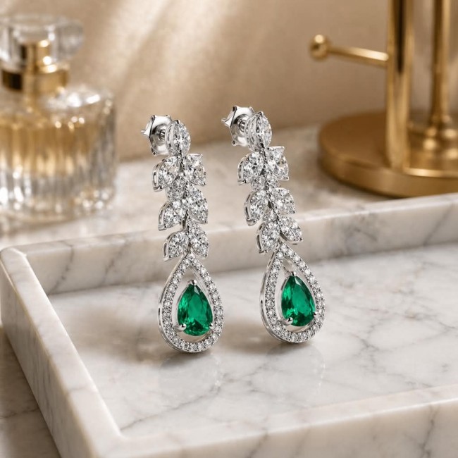 Gabriella 6.7 carat authentic Emerald rhodium over .925 Sterling Silver handcrafted Statement earrings - Elegant drop earrings with emerald and diamonds on marble tray.