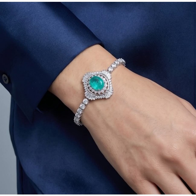 Vintage style - Timless Beauty - 10.5 carat Colombian Emerald 7.8 carat White Topaz .925 Sterling Silver handcrafted Statement bracelet - Emerald bracelet worn on hand, showing vintage style and details.