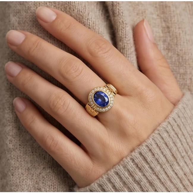 Born to Glam 4.1 carat natural Tanzanite .925 Sterling Silver dipped in 18K Gold Perfectly handcrafted Ring s. 7 - Worn on hand: Tanzanite ring, gold band with diamond accents.