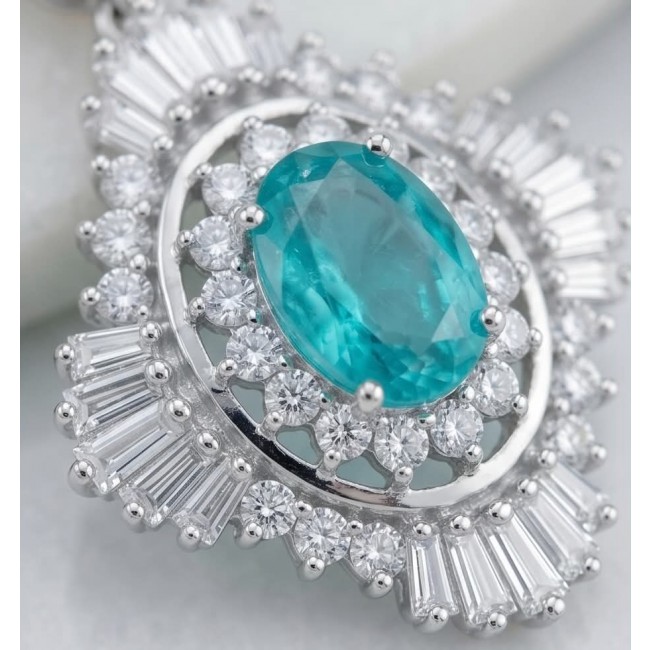 Pure Luxury 6.2 carat natural Colombian Emerald .925 Sterling Silver handmade Statement earrings - Close-up of oval emerald ring with diamond halo in silver setting.