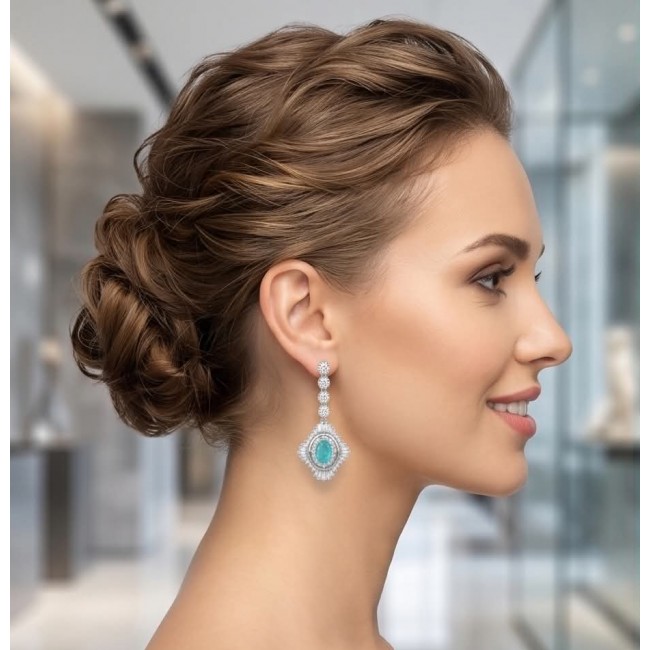 Pure Luxury 6.2 carat natural Colombian Emerald .925 Sterling Silver handmade Statement earrings - Side view of woman wearing Pure Luxury Colombian Emerald earrings