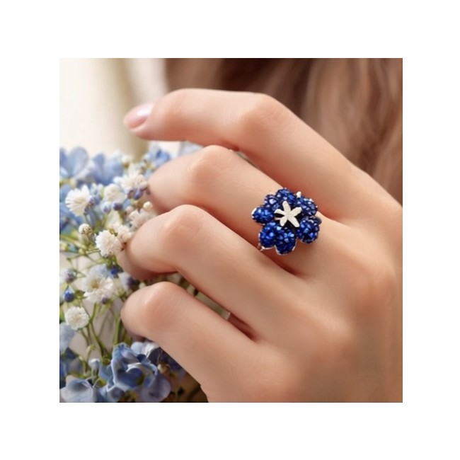 Blue Flower 12.2 carat natural Sapphire .925 Sterling Silver Perfectly handcrafted Ring s. 7 1/4 - Blue flower sapphire ring worn on hand with flowers in background