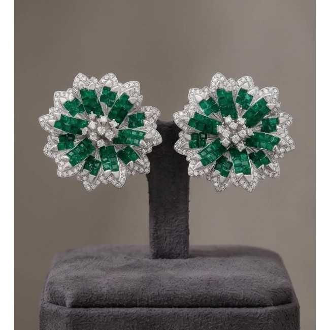 Born to Glam authentic 22.9 carat Colombian Emerald .925 Sterling Silver handcrafted earrings - Emerald and diamond earrings on display stand, front view.