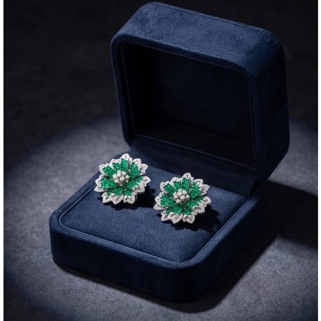 Born to Glam authentic 22.9 carat Colombian Emerald .925 Sterling Silver handcrafted earrings - Emerald earrings in open navy box, top view.
