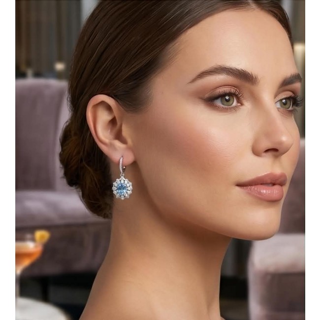 Serenity 4.5 carat genuine Swiss Blue Topaz .925 Sterling Silver handmade earrings - Side view of woman wearing Serenity 4.5 carat Swiss Blue Topaz earrings