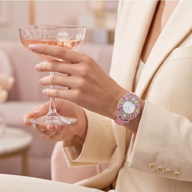 Precious 18.5 carat Authentic Pink Sapphire Genuine Leather strap .925 Sterling Silver handmade Watch - Worn on wrist, pink sapphire watch, holding a champagne glass.