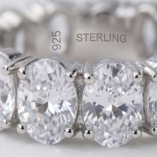 Luxurious 6.5 carat White Topaz .925 Sterling Silver infinity ring size 6 3/4 - Close-up of white topaz stones on .925 sterling silver ring.