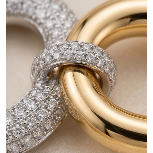 TIFFANY - LUXURIUS - Natural 22K Gold over .925 Sterling Silver handmade earrings - Close-up of interlocking gold and diamond-encrusted rings.