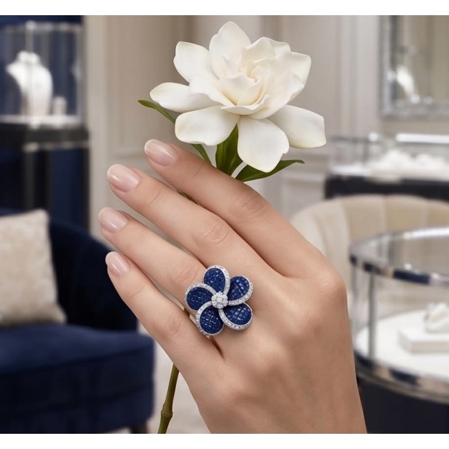 Born to Glam 15.2 carat natural Sapphire .925 Sterling Silver Perfectly handcrafted Ring s. 6 1/4 - Hand wearing Born to Glam sapphire flower ring holding a white flower.