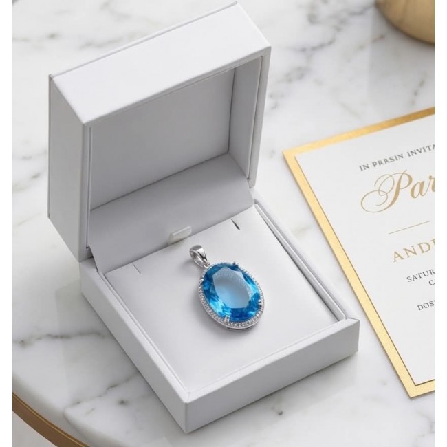 Eau Pure 18.5 carat Swiss Blue Topaz .925 Sterling Silver Handcrafted Pendant - Open box with Swiss Blue Topaz pendant on display