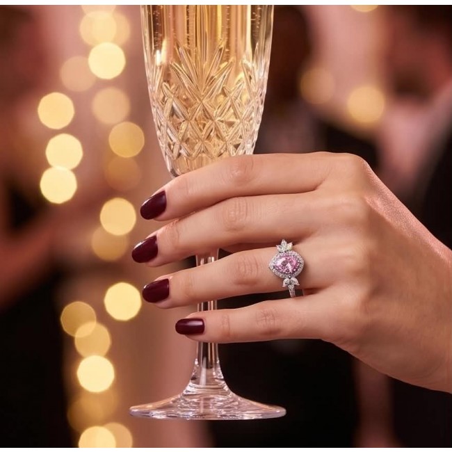 Anastasia 4.2 carat Pink Topaz .925 Sterling Silver Handcrafted Statement Ring size 6 - Pink topaz ring on hand holding champagne glass, front view.