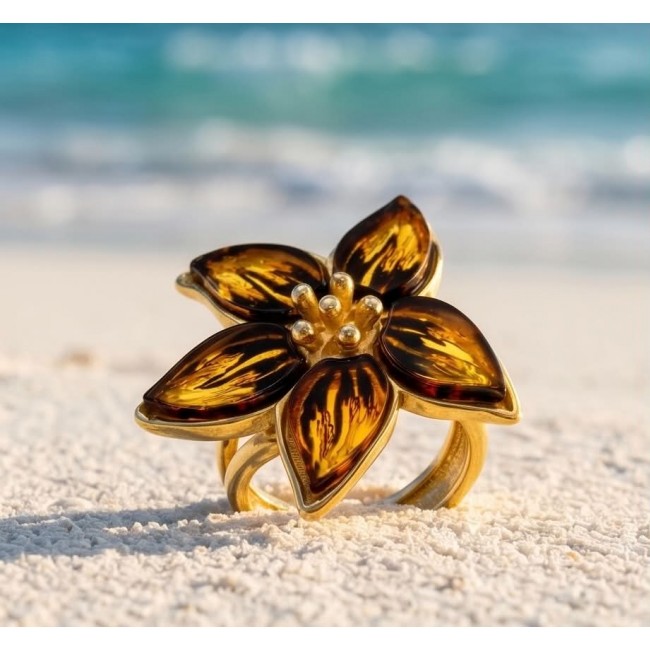 Golden Flower Authentic Baltic Amber 18K Gold over .925 Sterling Silver handcrafted ring; s. 7 adjustable - Golden flower ring with amber petals on sandy beach, close-up view.