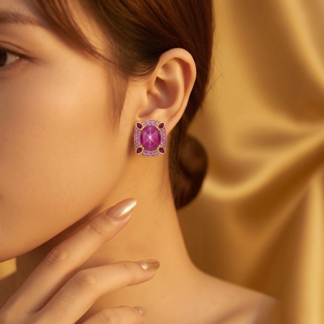 Red Cascade 16.2 carat Star Ruby .925 Sterling Silver dipped in real 22K Gold brilliantly handcrafted earrings - Close-up of 16.2 carat Star Ruby earring worn on ear
