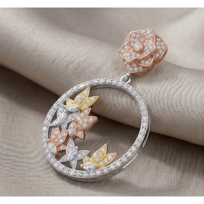 Black Label Collection - Floral design - Natural White Topaz 22K Gold over .925 Sterling Silver handmade 3 tones earrings - Close-up of floral design pendant with white topaz stones.