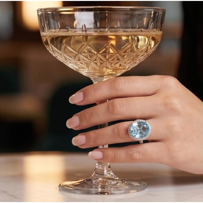 Angelina 14.9 carat authentic Aquamarine .925 Sterling Silver Handcrafted Ring size 6 1/4 - Aquamarine ring worn on hand holding a crystal glass.