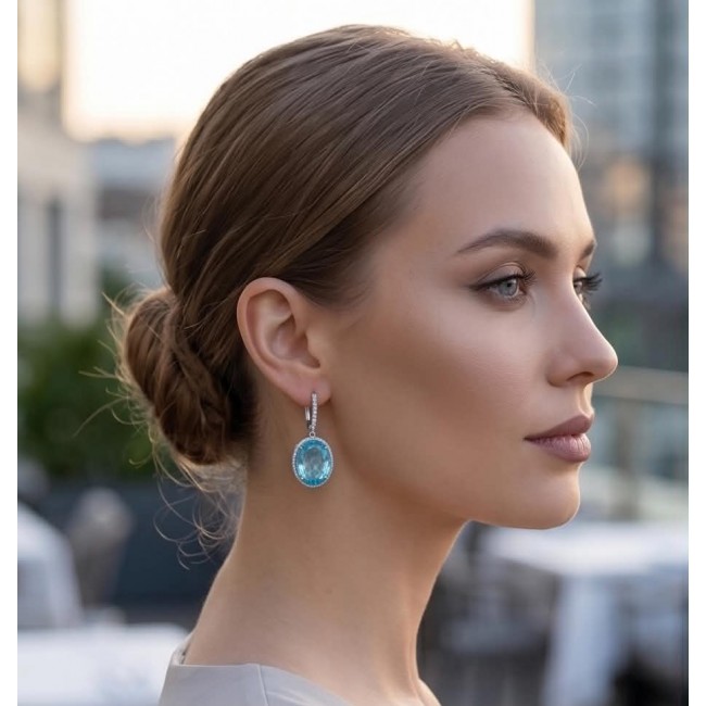 Angelina 20.9 carat authentic Aquamarine .925 Sterling Silver Handcrafted Earrings - Side view of woman wearing Angelina 20.9 carat aquamarine earrings