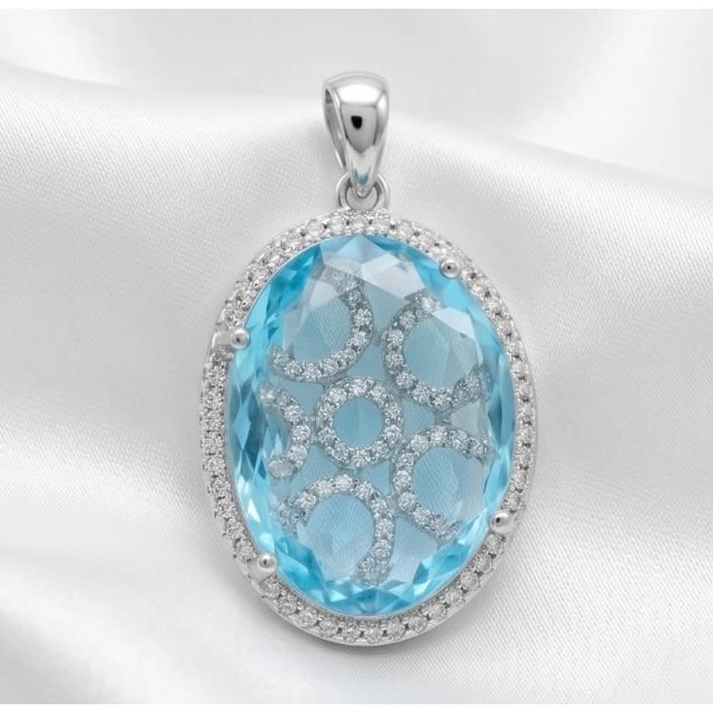 Angelina 14.9 carat authentic Aquamarine .925 Sterling Silver Handcrafted pendant - Close-up of oval aquamarine pendant with silver detailing on white fabric