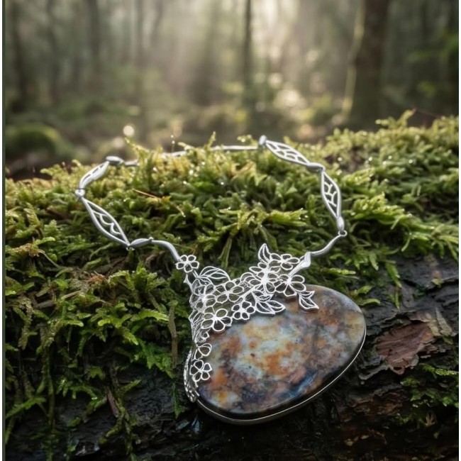Huge Authenic Australian Boulder Opal .925 Sterling Silver dipped in rhodium brilliantly handcrafted necklace - Close-up of Australian Boulder Opal necklace on moss in the forest.
