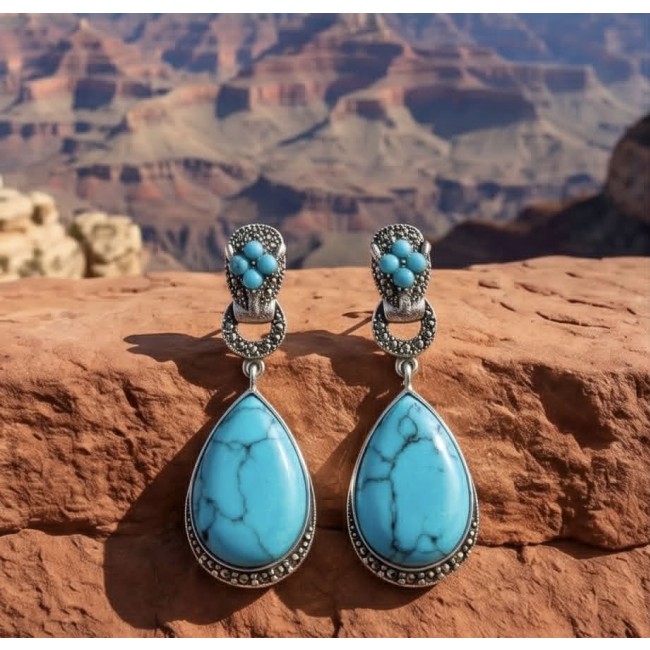 Gephard - Spectacular inkay Turquoise Marcasite .925 Sterling Silver handcrafted Earrings - Turquoise earrings on rock with canyon background, front view.