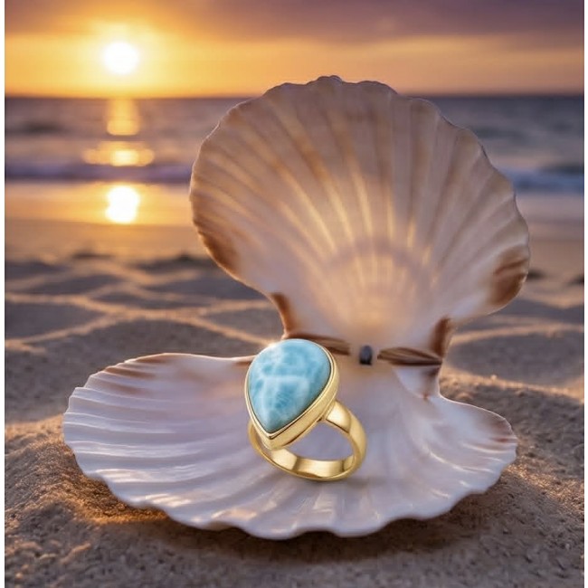 Perfection 14.9 carat Blue Larimar 18K Gold over .925 Sterling Silver handmade ring size 7 adjustable - Blue larimar ring in open shell on beach at sunset, front view.