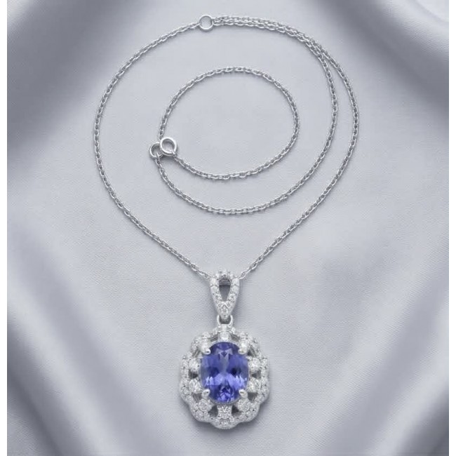 Giovanna - Authentic oval cut 6.8 carat Tanzanite .925 Sterling Silver handcrafted Necklace - Oval-cut Tanzanite necklace, top view, on a silver chain with diamond accents.