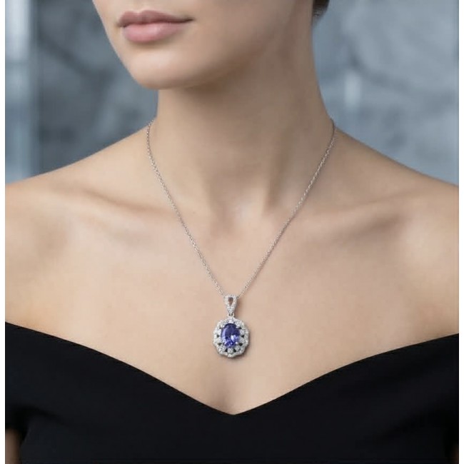 Giovanna - Authentic oval cut 6.8 carat Tanzanite .925 Sterling Silver handcrafted Necklace - Model wearing Giovanna Tanzanite pendant on silver chain, front view.