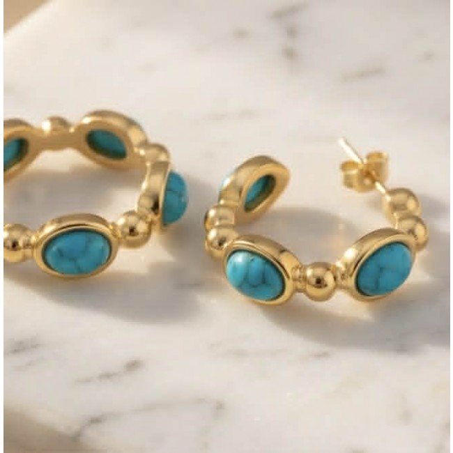 Great quality - authentic Dragon's Skin Turquoise 18K Gold over .925 Sterling Silver handcrafted Earrings - Turquoise and gold hoop earrings on marble surface, front view.