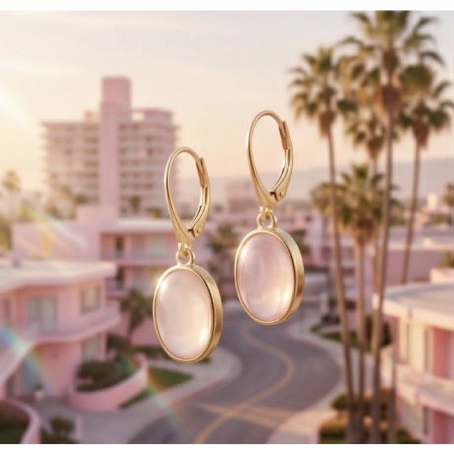 Authentic 10.2 carat Rose Quartz 18K Gold over .925 Silver handcrafted Statement earrings - Rose quartz earrings in front of palm trees, close-up.