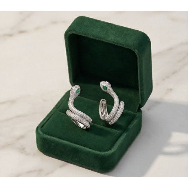 Cobra SNAKE Emerald White Sapphire Snakes 0.5 carat Emerald .925 Sterling Silver earrings - Cobra snake ring with emerald eyes in green box, top view.