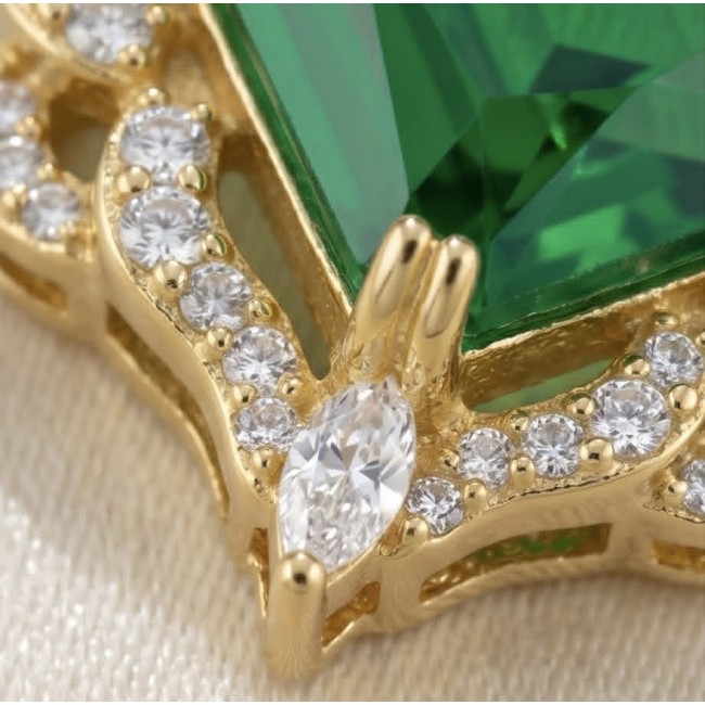 Magnificent Jewel 12.5 carat Emerald 14K Gold over .925 Sterling Silver handcrafted earrings - Close-up of emerald jewel with gold setting and small diamonds.