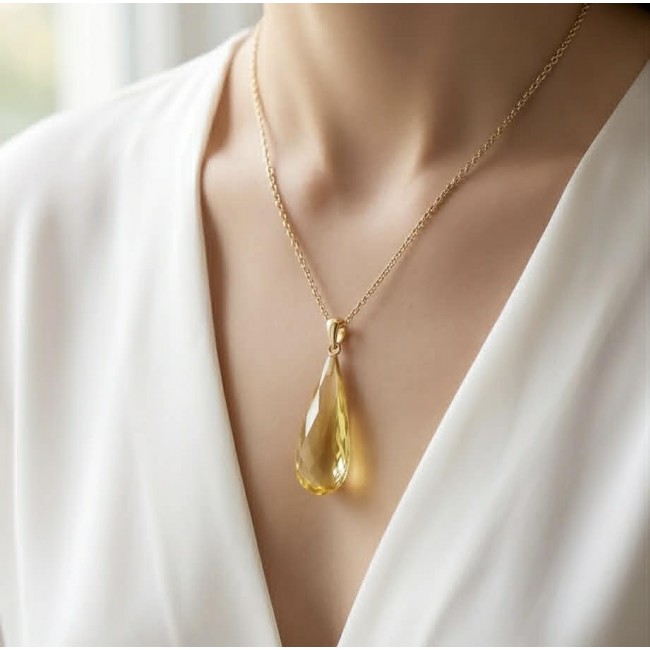 Prehistoric Authentic faceted Golden Baltic Amber REAL 14k Gold beautifully handcrafted Pendant - Golden Baltic Amber necklace worn on neck, front view.