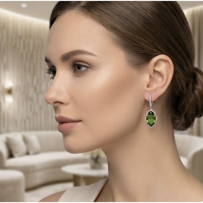 Royalty 9.9 carat authentic Himalayan Peridot .925 Sterling Silver Handcrafted Statement Earrings - Side view of woman wearing Royalty 9.9 carat Peridot earrings.