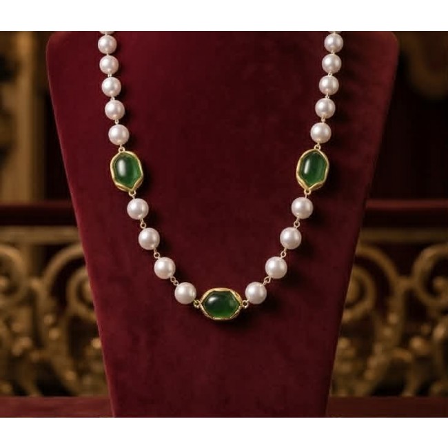 Incredible 48 inches long Freshwater Pearl 10K Gold over .925 Sterling Silver handmade Necklace - Front view of freshwater pearl and green gem necklace on display stand.
