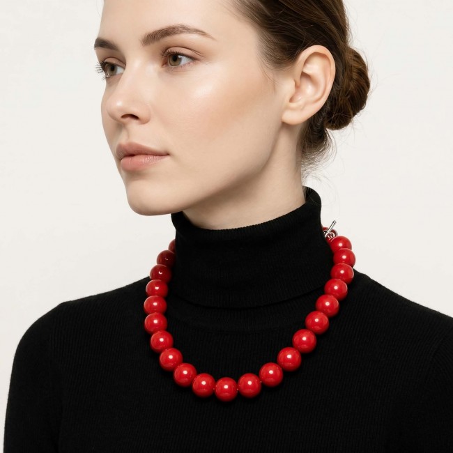 Konstancia Sublime natural Red Fossilized Coral Sterling Silver handmade Necklace - Side view of red fossilized coral necklace worn on woman.