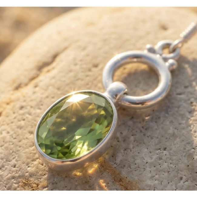 Royalty 8.9 carat authentic Brazilian Peridot .925 Sterling Silver Handcrafted Statement Earrings - Close-up of a Brazilian Peridot pendant in sterling silver in sunlight.