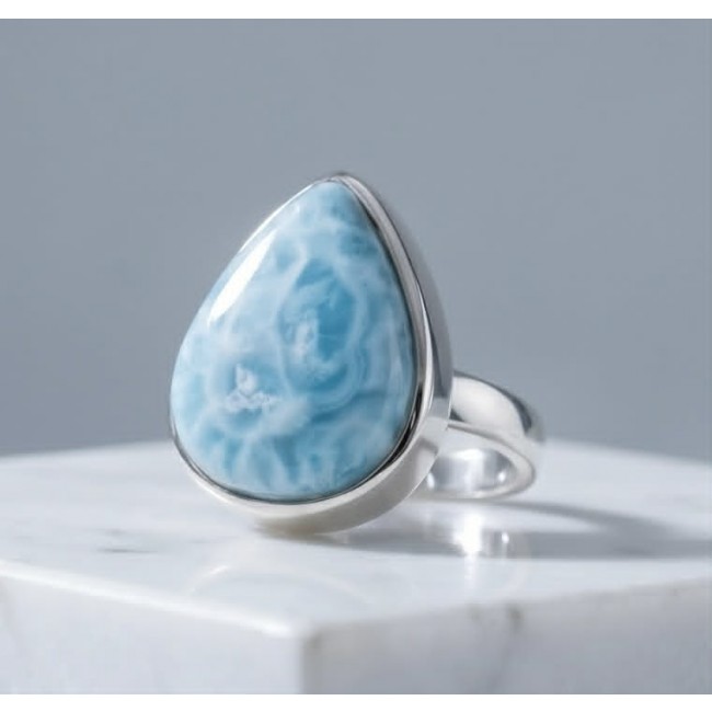 Rare and Spectacular 2259 carat authentic Andean (Peruvian) Blue Opal .925 Sterling Silver Handcrafted Ring size 8 - Close-up of a silver ring with a large blue stone on a marble surface.