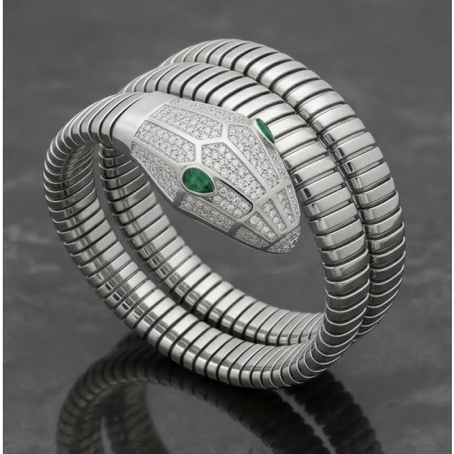 SERPENTINE Precious Snake Genuine 4.2 carat Emerald 925 Sterling Silver handcrafted Bracelet - Serpentine silver snake bracelet with emerald eyes, coiled on display.
