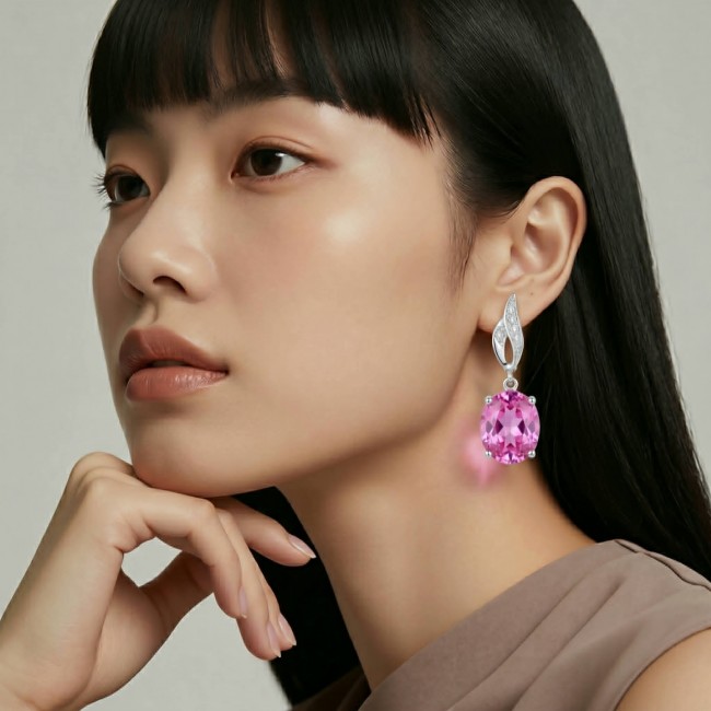 Tiffany - authentic 14.5 carat Pink Topaz .925 Sterling Silver handcrafted Earrings - Side view of woman wearing pink topaz drop earring.