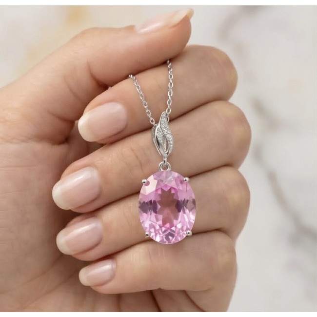 Tiffany - authentic 14.5 carat Pink Topaz .925 Sterling Silver handcrafted Statement pendant - Pink Topaz pendant in hand, showing stone and chain detail.