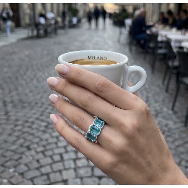 Angel's Wish 22.8 carat Aquamarine .925 Sterling Silver handcrafted infinity ring size 7 3/4 - Aquamarine ring on hand holding coffee in a street setting.