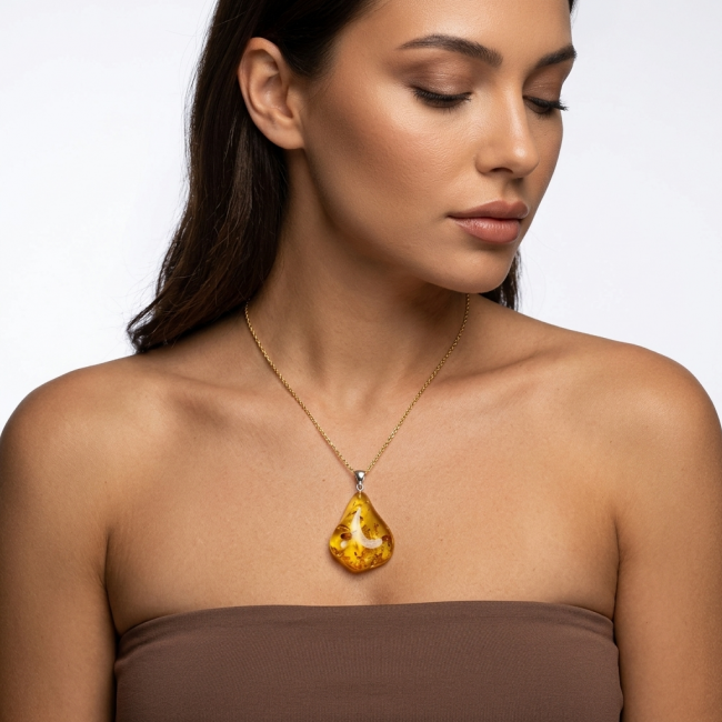 Sea Treasure Prehistoric Authentic Baltic Amber .925 Sterling Silver beautifully handcrafted Pendant - Woman wearing Sea Treasure Baltic Amber necklace, front view.