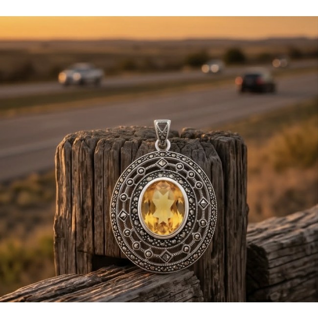 Costa del Sol 10.8 carat Citrine MARCASITE .925 Sterling Silver handcrafted Statement pendant - Citrine pendant on wood against sunset background, front view.