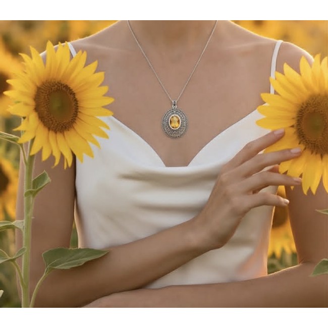 Costa del Sol 10.8 carat Citrine MARCASITE .925 Sterling Silver handcrafted Statement pendant - Necklace worn on neck, sunflower background, highlighting citrine pendant.