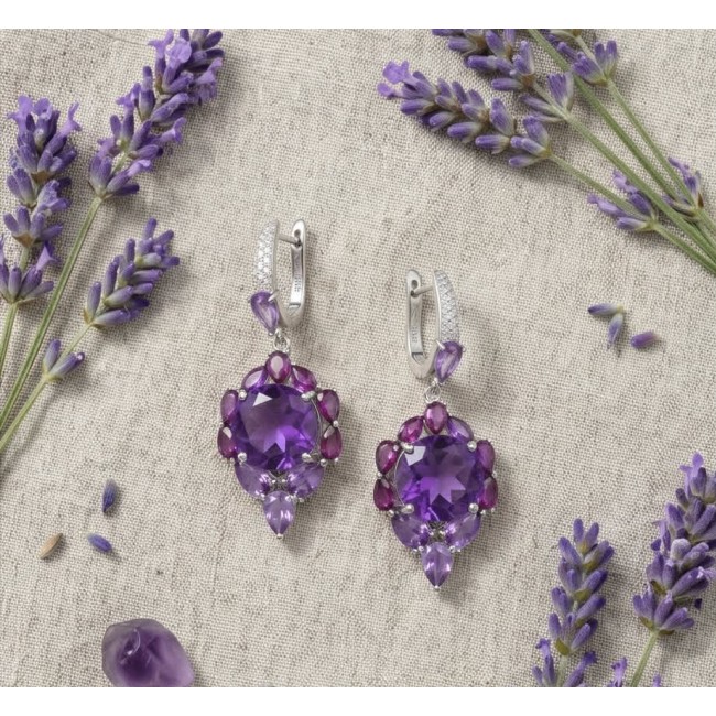 Lavender Beauty authentic 12.2 carat Amethyst .925 Sterling Silver dipped in rhodium handcrafted earrings - Amethyst earrings with lavender accents on linen background, top view.