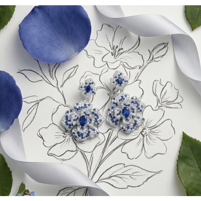 Oceania - 9.5 carat Sapphire .925 Sterling Silver dipped in Rhodium handmade Statement earrings - Overhead view of sapphire and sterling silver floral earrings on sketch