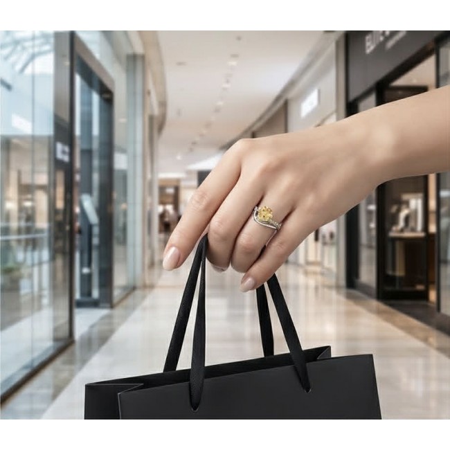 Golden Treasure 4.5 carat Citrine .925 Sterling Silver Handcrafted Ring size 8 - Citrine ring on hand holding shopping bag, showcasing stone and setting.