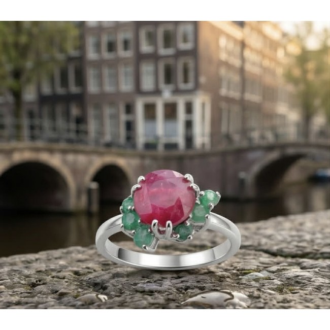 Authentic 5.2 carat Mozambique Ruby .925 Sterling Silver brilliantly handcrafted ring s. 9 - Ruby ring with emerald accents on stone close-up in urban background